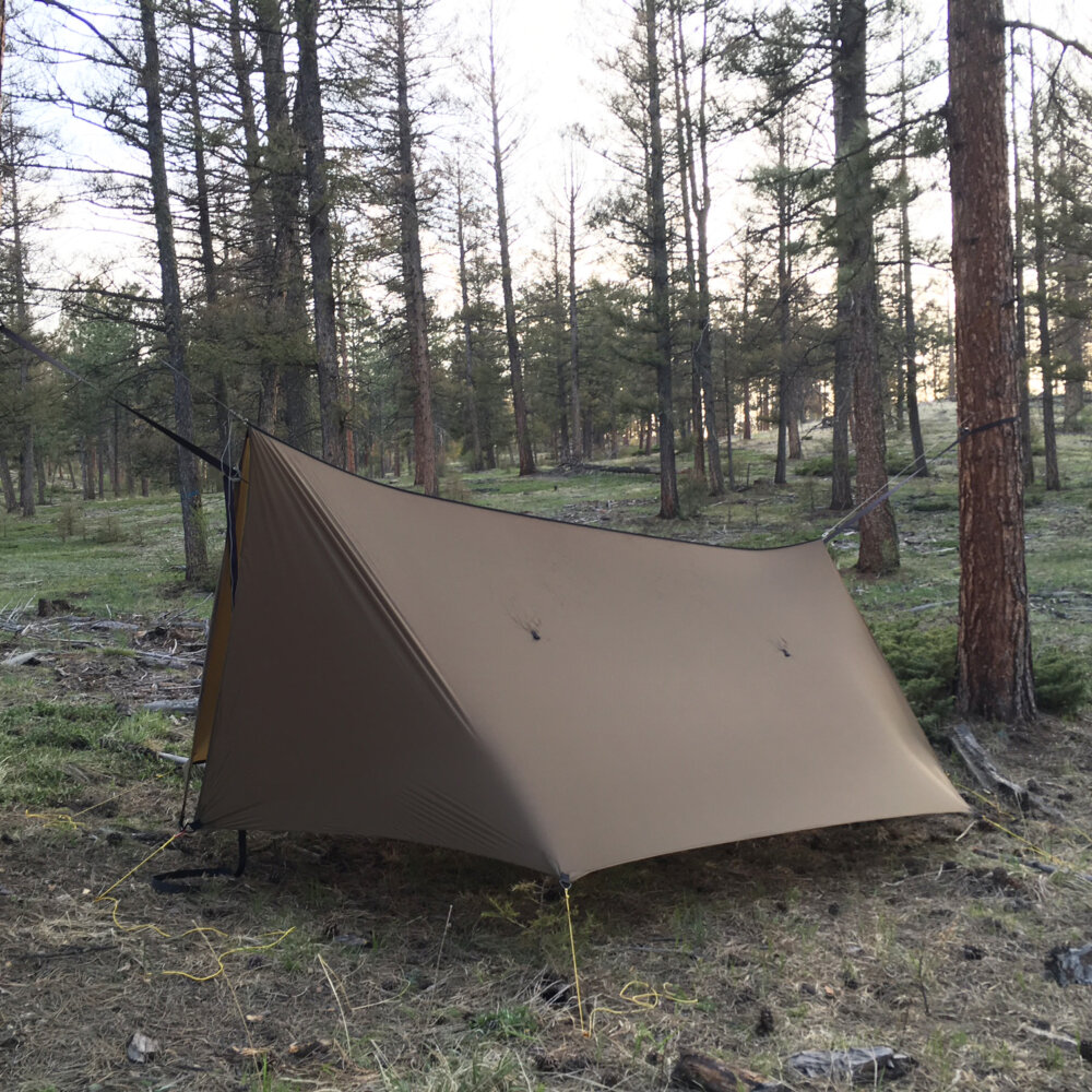 brown superfly tarp in the woods