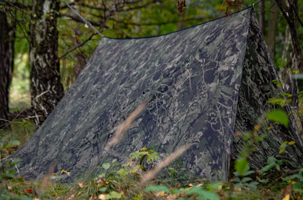 Shadow Pine Bushwack Camouflage ground tarp pitched in the woods